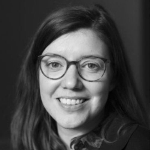 Ashden team member, Lucy Blackburn smiling in black and white