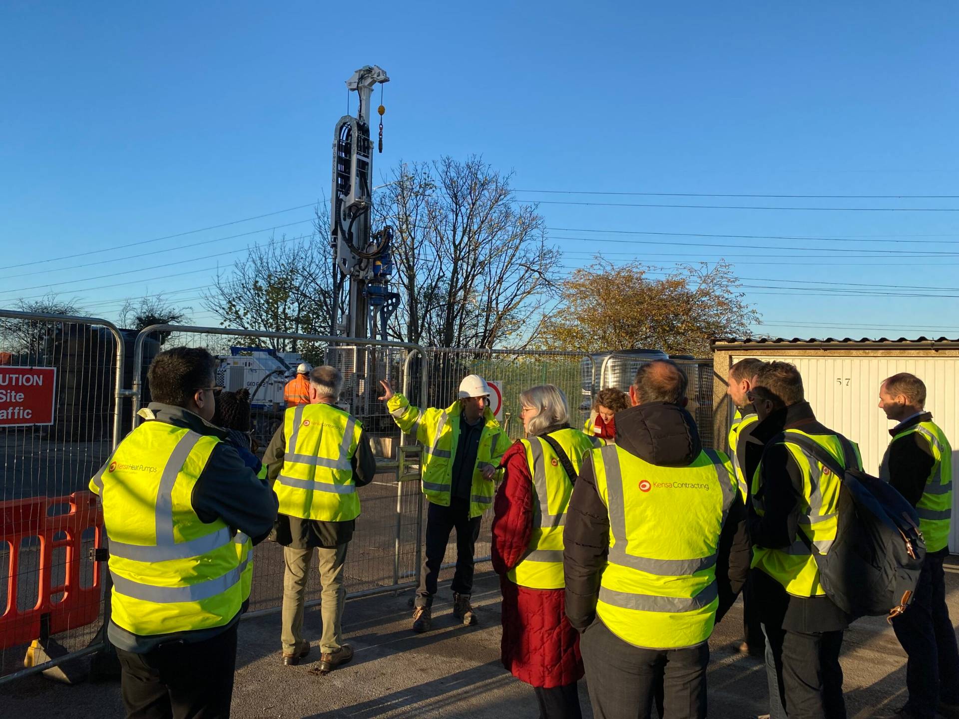 Funders, local councils and climate collaborators are gathered together at an Ashden 'Seeing is believing' event where a heat pump is being installed.