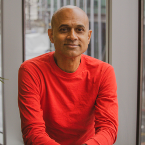 Man sitting and smiling at camera