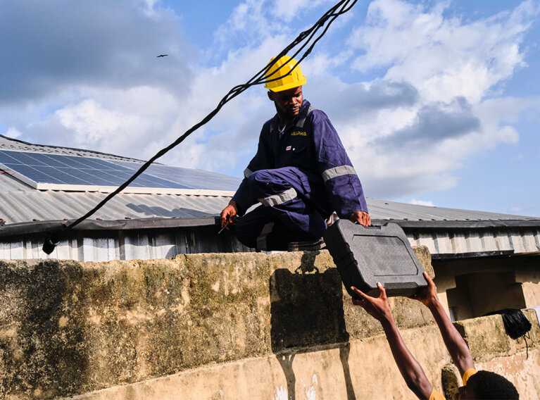 Salpha engineer installing solar panels