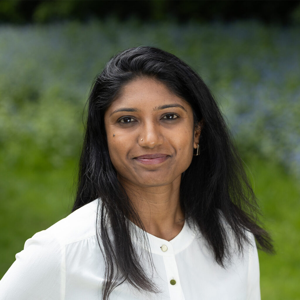 A headshot of a woman smiling at the camera