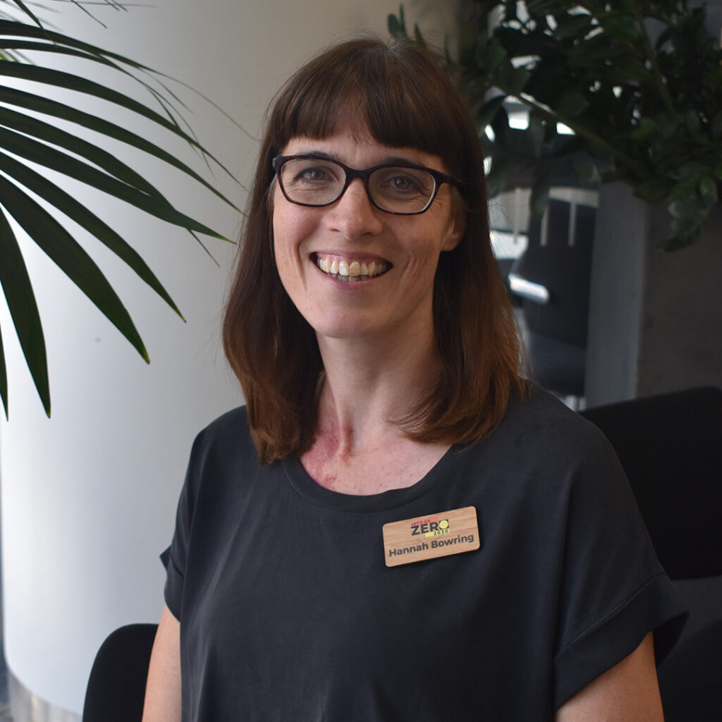 Woman in dark navy top smiling