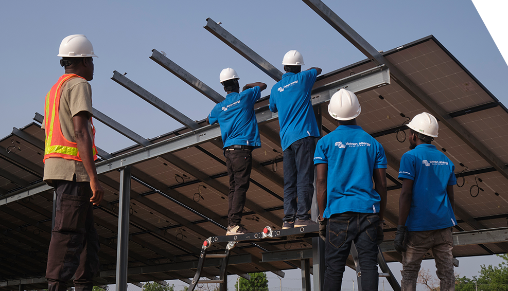 Workers at Sosia, in northern Nigeria, are installing new solar panels.
