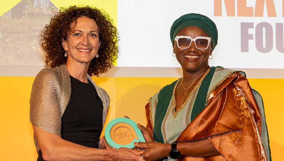Habiba Ali from Sosia receives the 2025 Ashden Award for Breaking Barriers from award sponsor Next Energy Foundation