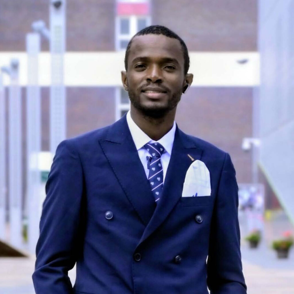 A man wearing a suit smiling